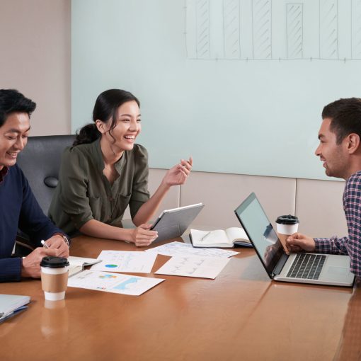 Business meeting Cheerful business people having meeting in office